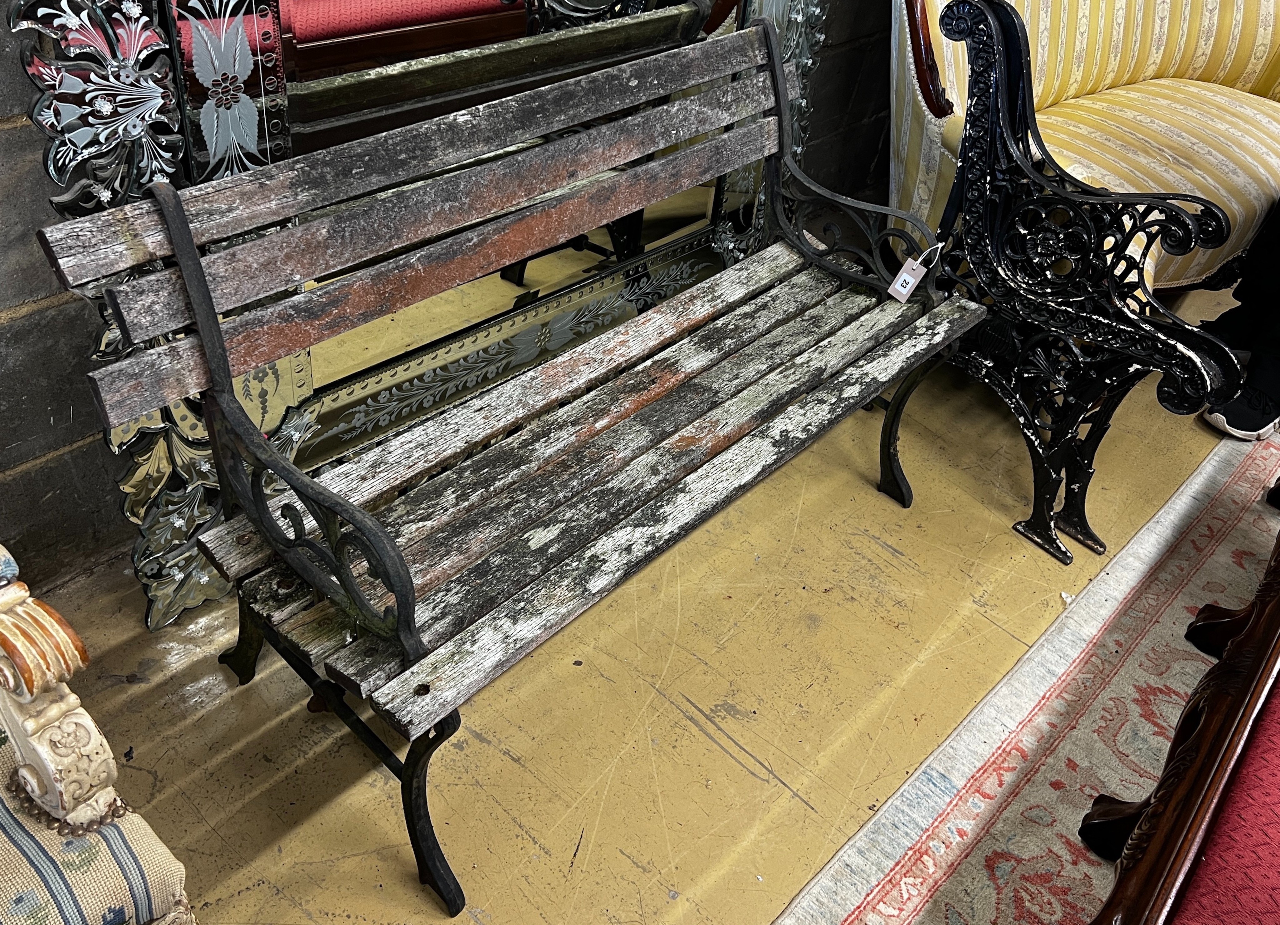 A Victorian style aluminium slatted garden bench, length 122cm together with a pair of cast metal bench ends